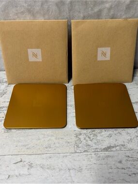 NEW Nespresso Set of 2 Bronze Gold Coasters 25% Recycled Aluminum Cork Backed
